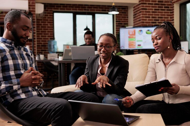 Professional Kenyan entrepreneur working on laptop